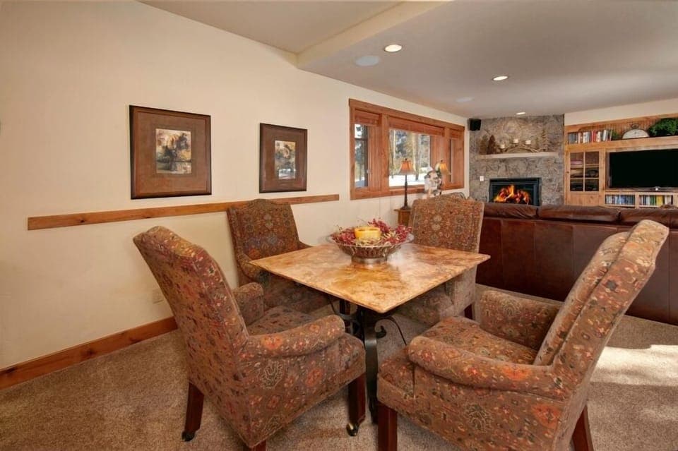 Lower level living area with gas fireplace, TV theater, wet bar and mini fridge.