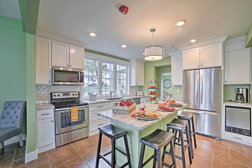The fully equipped kitchen features stainless steel appliances.