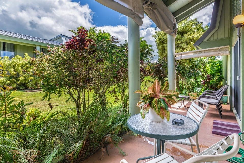 The large ground floor lanai is the perfect spot for enjoying a quiet morning, taking in the beautiful grounds, and sipping a cup of coffee.