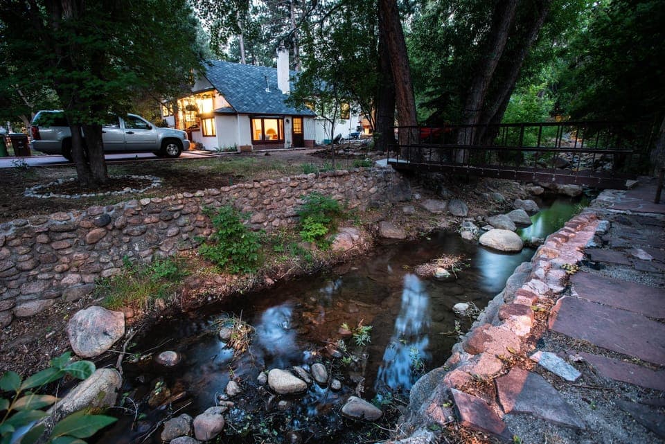 Open a bottle of wine and relax while sitting creekside 