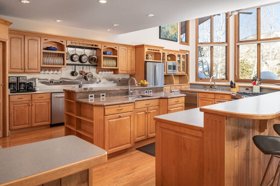 Three sinks, two dishwashers, and a walk-in pantry are just a few of the gourmet kitchen amenities