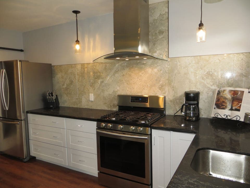 Newly remodeled apartment features stainless steel appliances and quartz counter