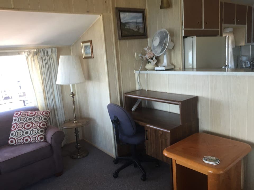 Couch turns into a second bed. Desk and fan are available.