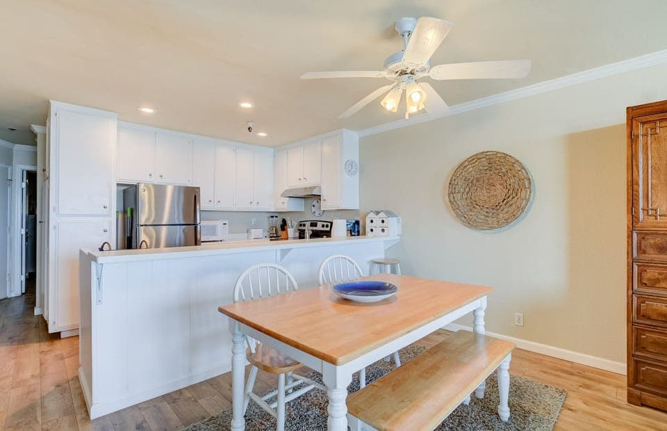Dining table has two benches and two chairs. Can easily accomodate 6 adults.