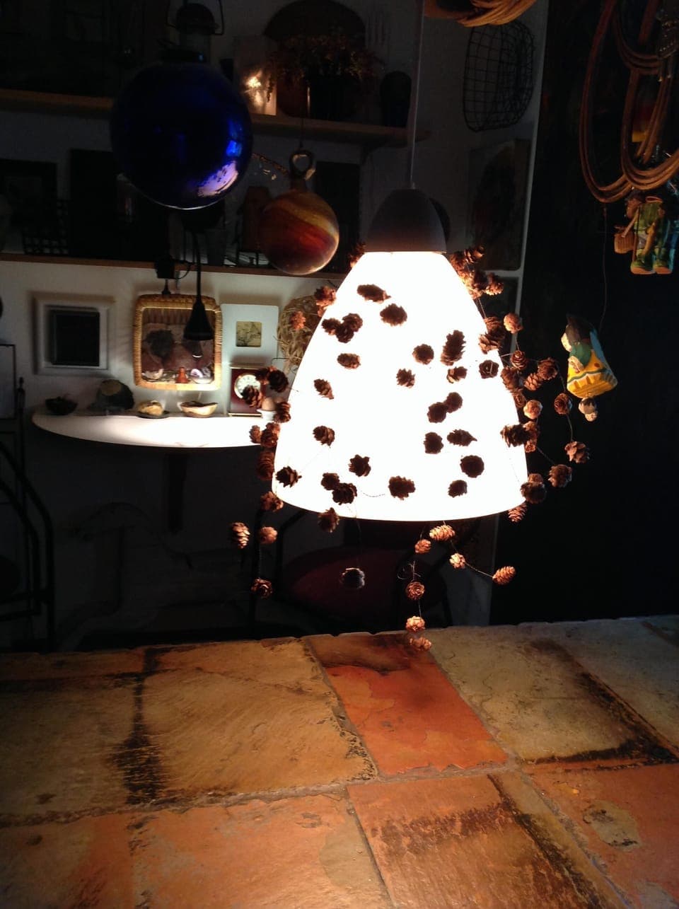 counter at night with hanging island light on a dimmer switch