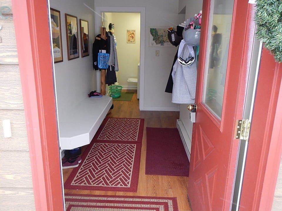 Front door to the mud room. Mud room has bench and hooks for your gear. 