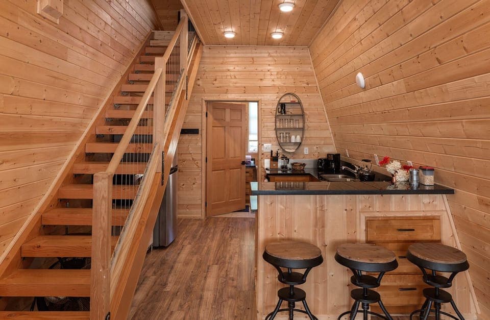 Annex kitchenette, bar and stairs to master bedroom. 
