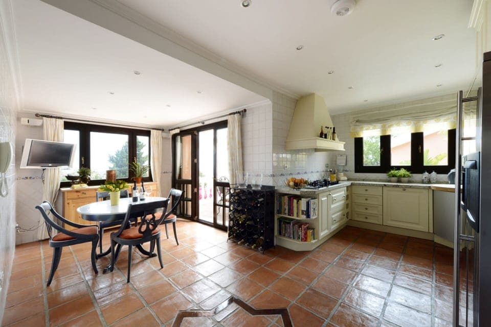Kitchen with outside  terrace.