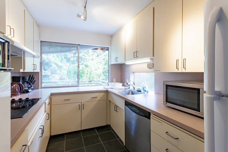 Kitchen view. Equipped with all cooking equipment and utensils.