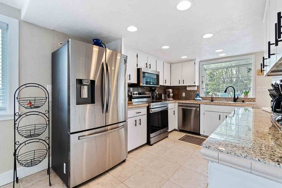 Cook a meal int the bright kitchen with updated appliances.