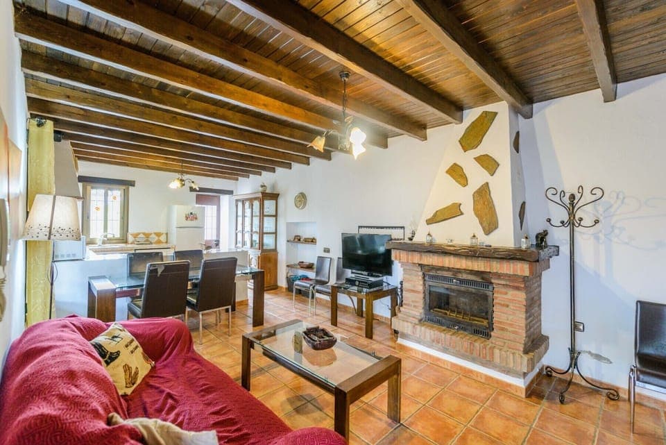 Enjoy the living room of this house with fireplace in Alhaurín el Grande
