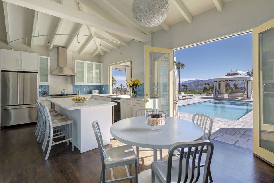 Kitchen features Viking appliances and direct pool access with incredible views.