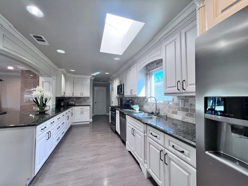 Custom Kitchen with granite countertops and stainless steel appliances