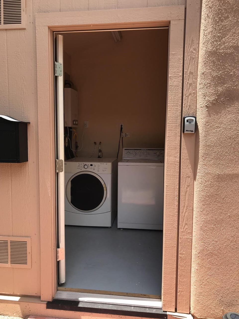 Your own laundry room with washer and dryer. The key is attached to the binder. 