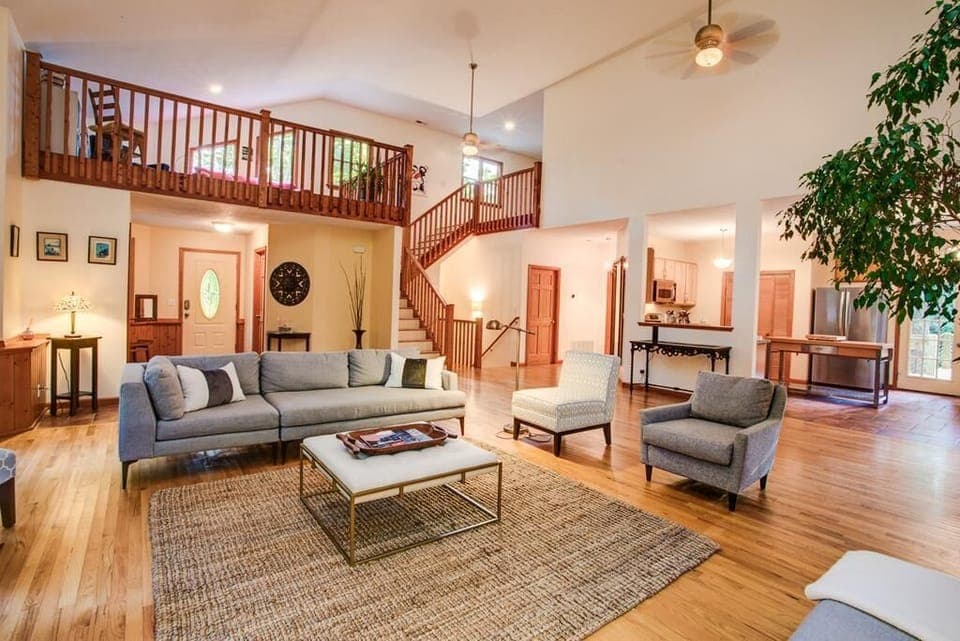 The Great Room w/ view of kitchen and upper lofts.