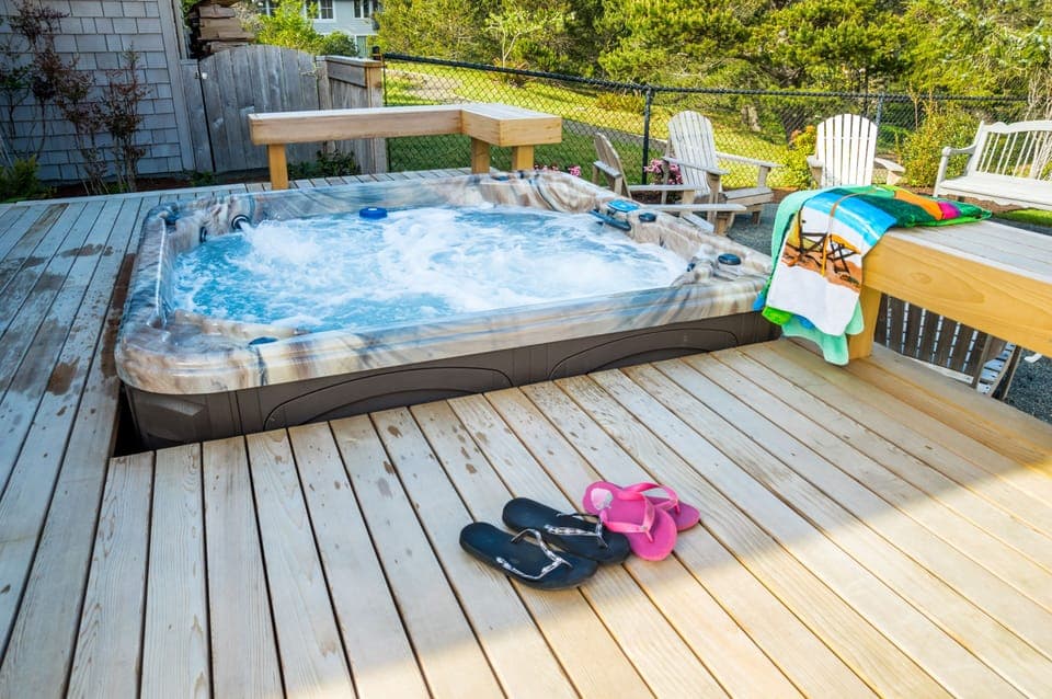 It's hot tub time!! Fenced yard with hot tub, large deck & fire pit!!