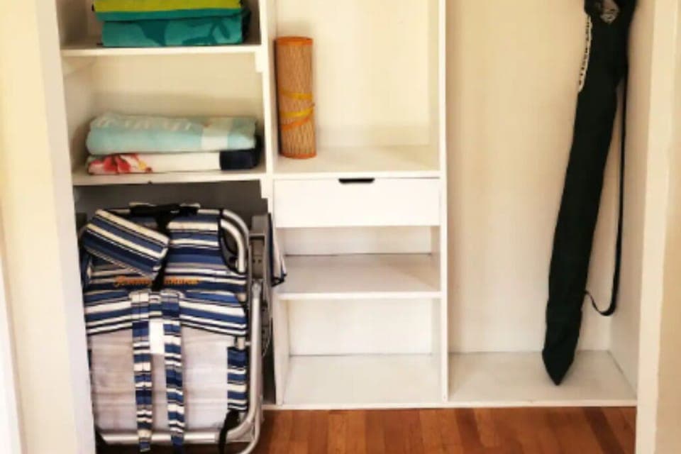 Private entryway to unit with beach supplies and storage.
