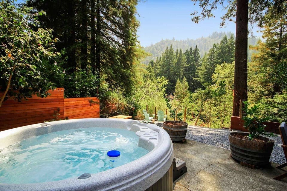 A hot tub with a view and private yard.