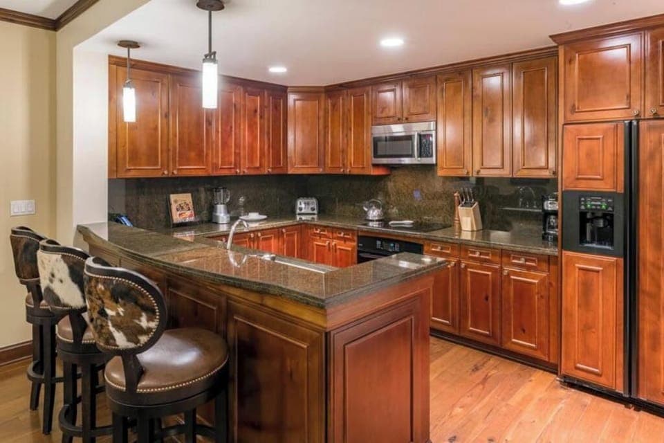 Gourmet kitchen with necessary cooking utensils