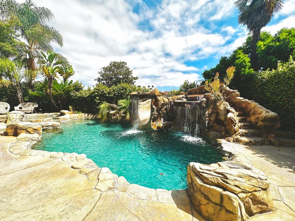 Salt water pool (3 - 8 feet deep), waterfalls, beach entry, and jacuzzi spa