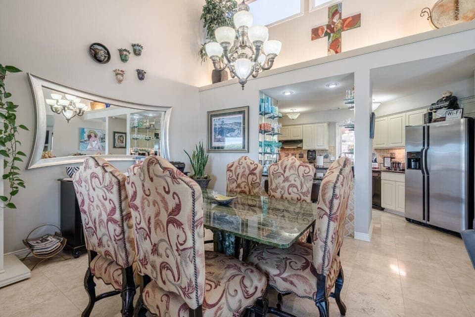 Dining table with seating for six.  Large granite top table. 