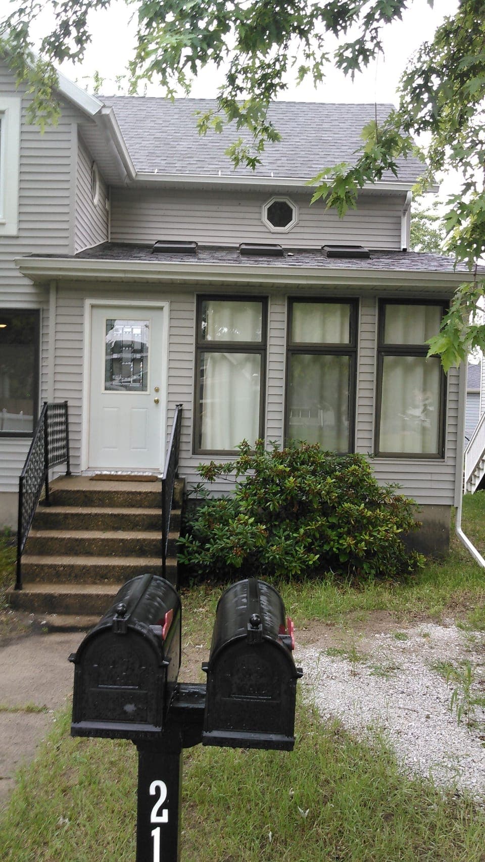 Entrance, West side of house (the bare spot was an attempt to make parking spot