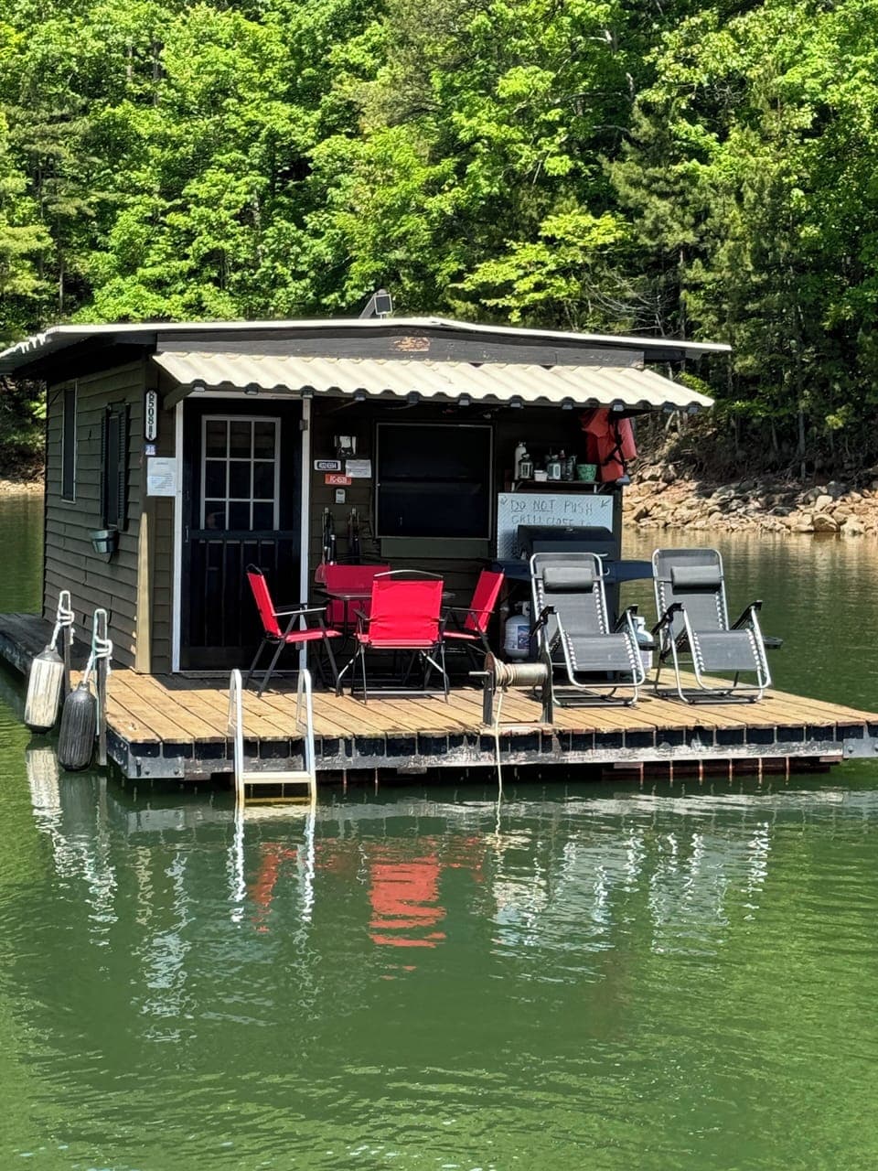 Boathouse w dining table for 4, 2 lounge chairs, propane grill, & 2 person kayak