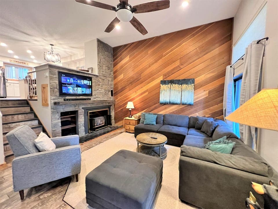 Great room with stone gas fireplace and sectional couch