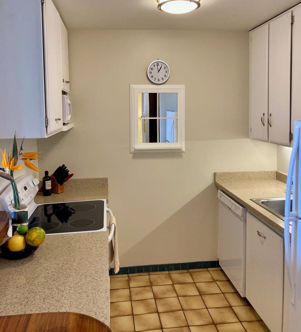 well lit, sparkling clean kitchen with full cooking and serving amenities
