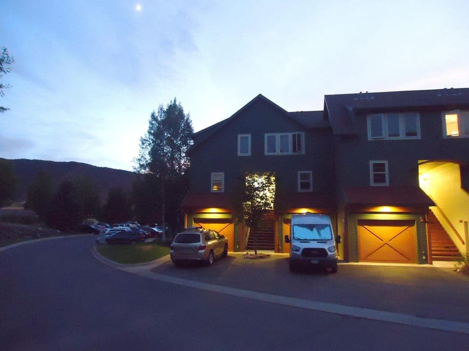 End-unit with parking in front of garage.