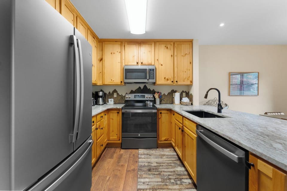 Full kitchen featuring newly upgraded countertops and appliances.