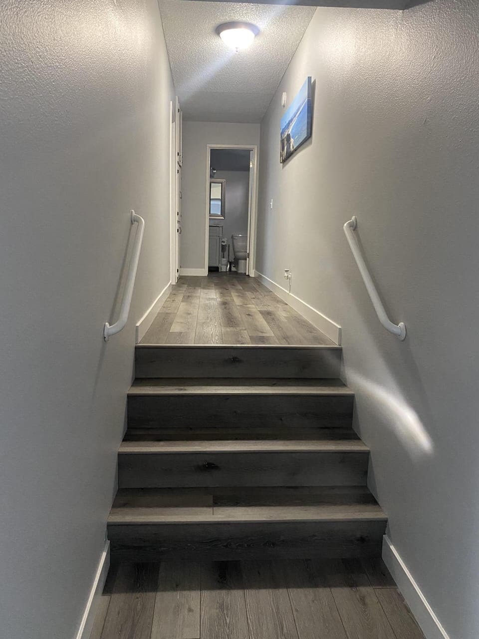 Hallway leads to bedroom and bathroom