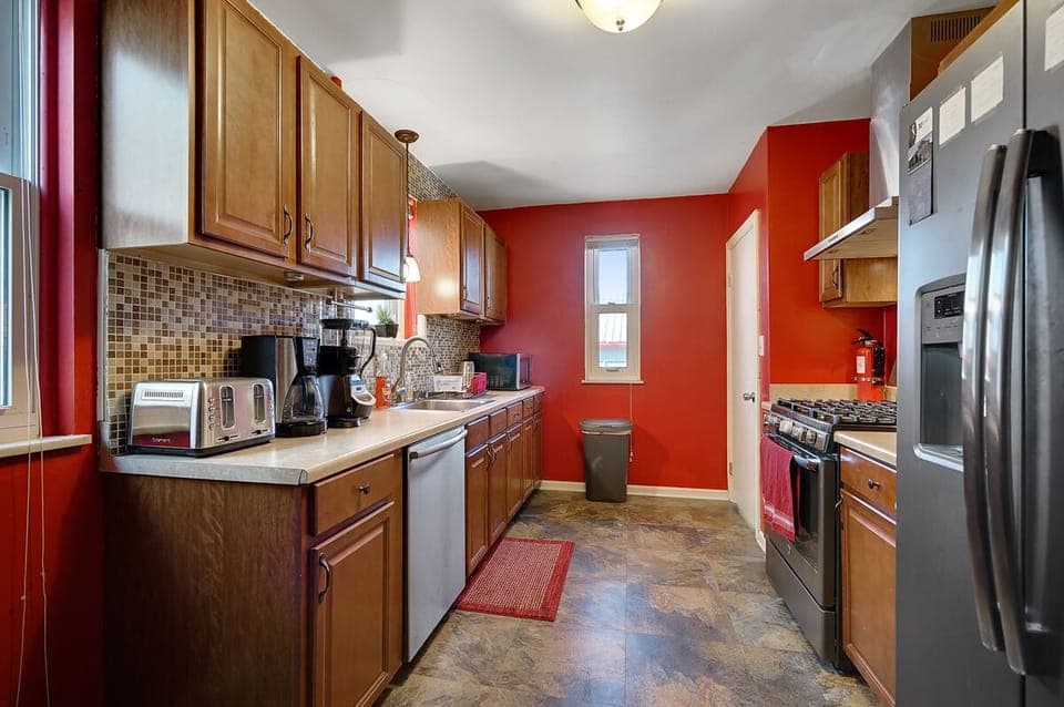 Huge Kitchen with new stainless steel double door refrigerator, oven & stove