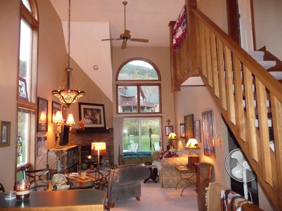 Gorgeous great room with oak staircase doors lead to awesome deck w/gas grill
 