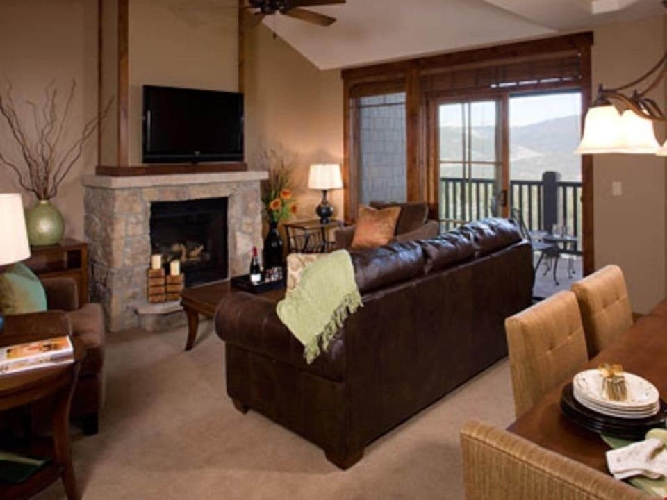 Relax in the luxurious living area, complete with a stone gas fireplace