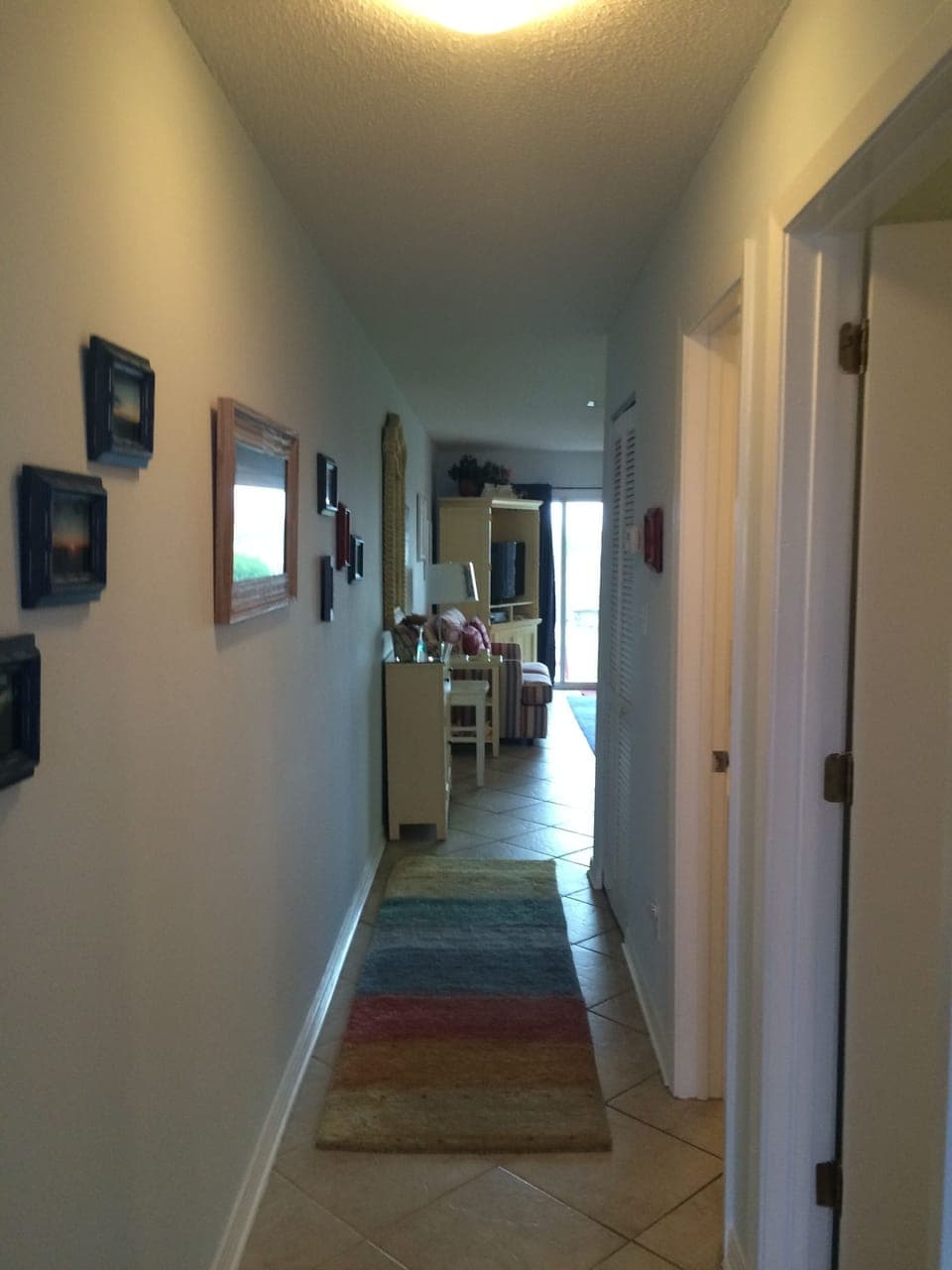 Hall to bedroom, full bath and living room