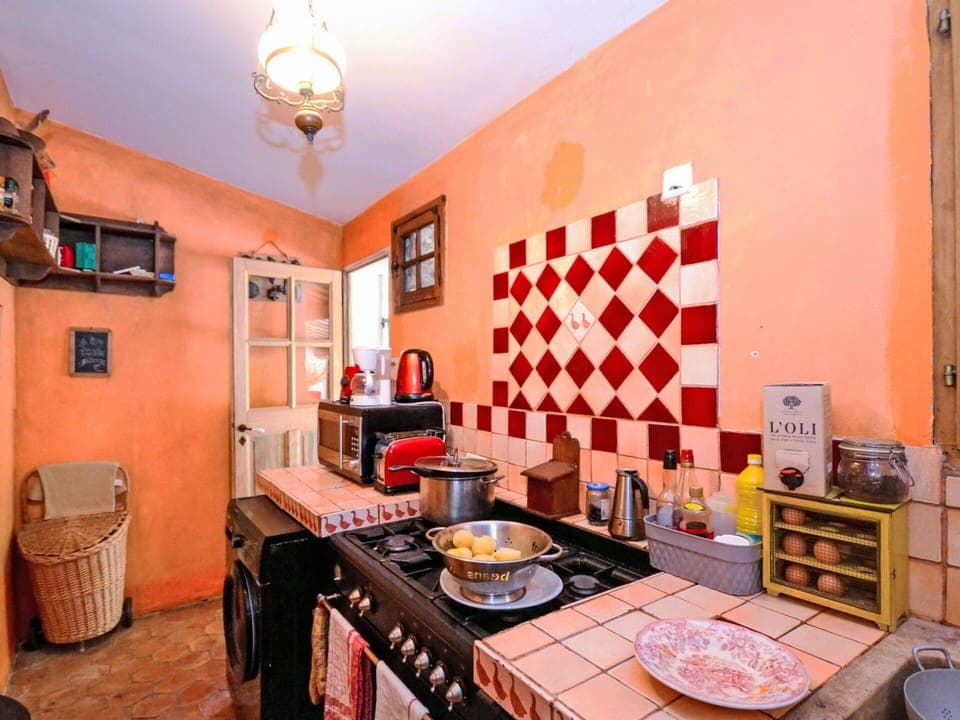 Furniture, Flooring, Interior Design, Kitchen, Room, Floor, Lighting, Home, Major Appliance, Kitchen Stove