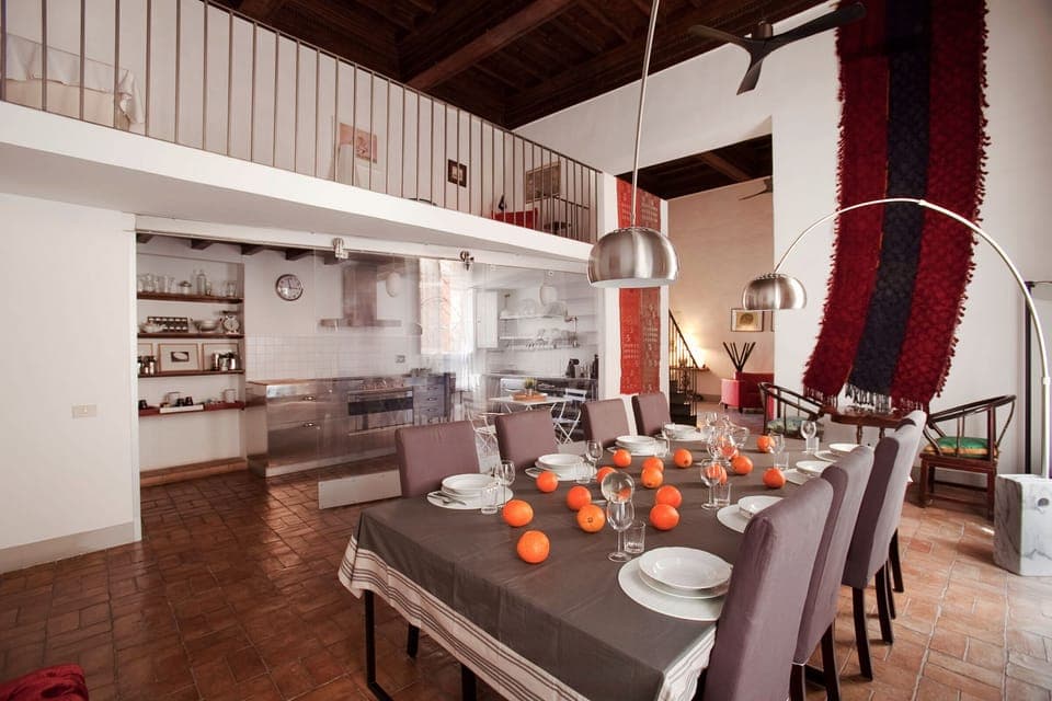 the dining room and the open view kitchen separated by a glass wall