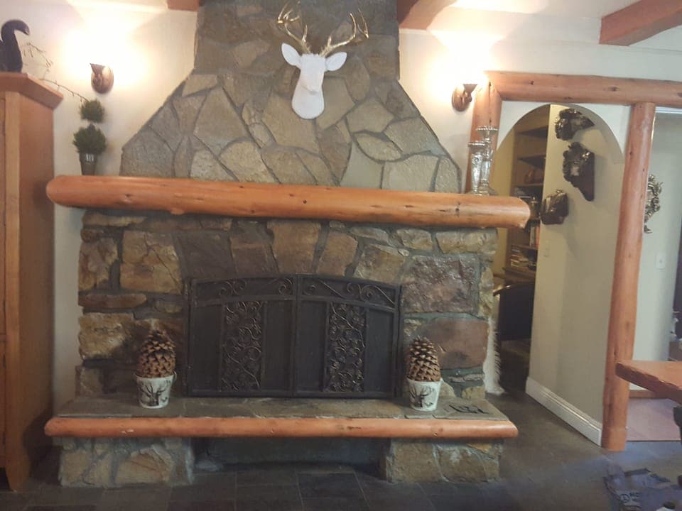 woodburning fireplace in livingroom/kitchen area