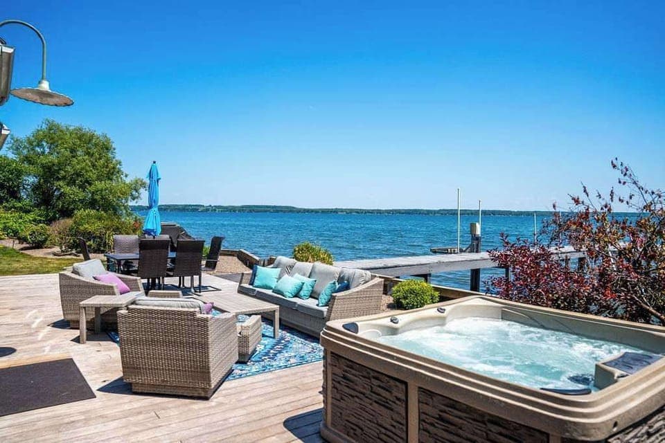 Soak and relax in your lakeview hot tub—ideal in any season. 