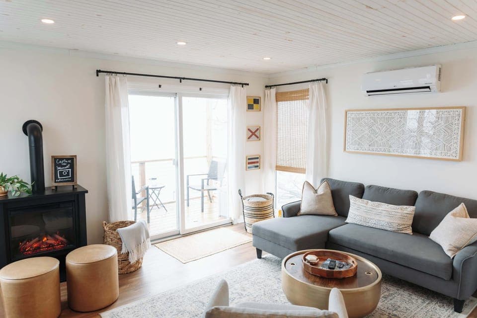 Relax and recharge in this bright and cozy lake-view living area.