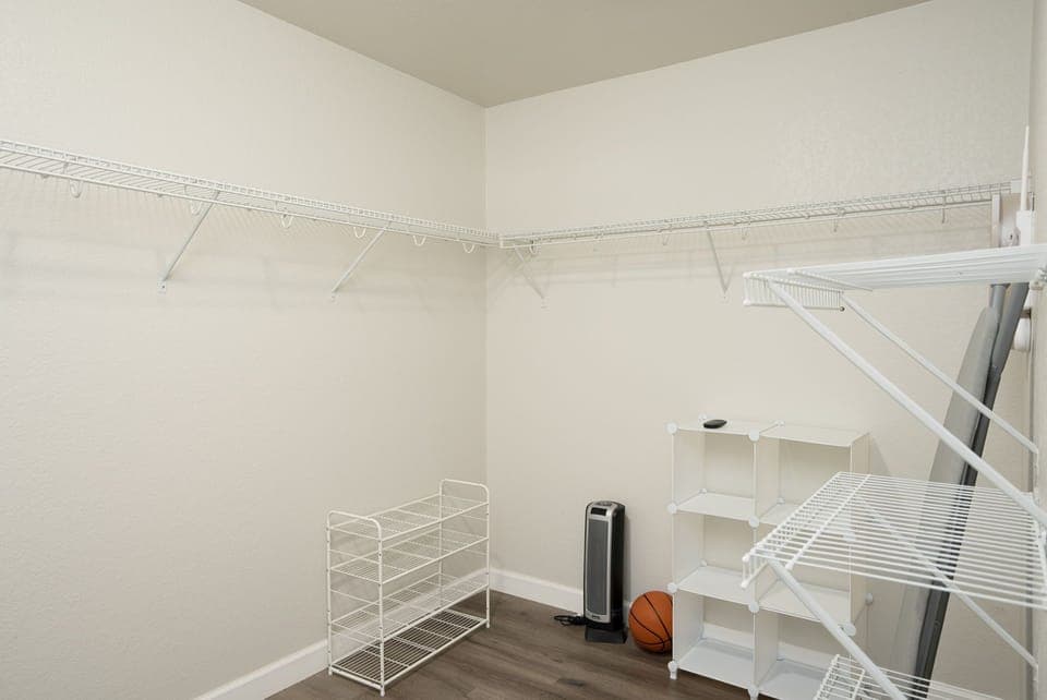 Store your belongings with ease in the spacious master walk-in closet.