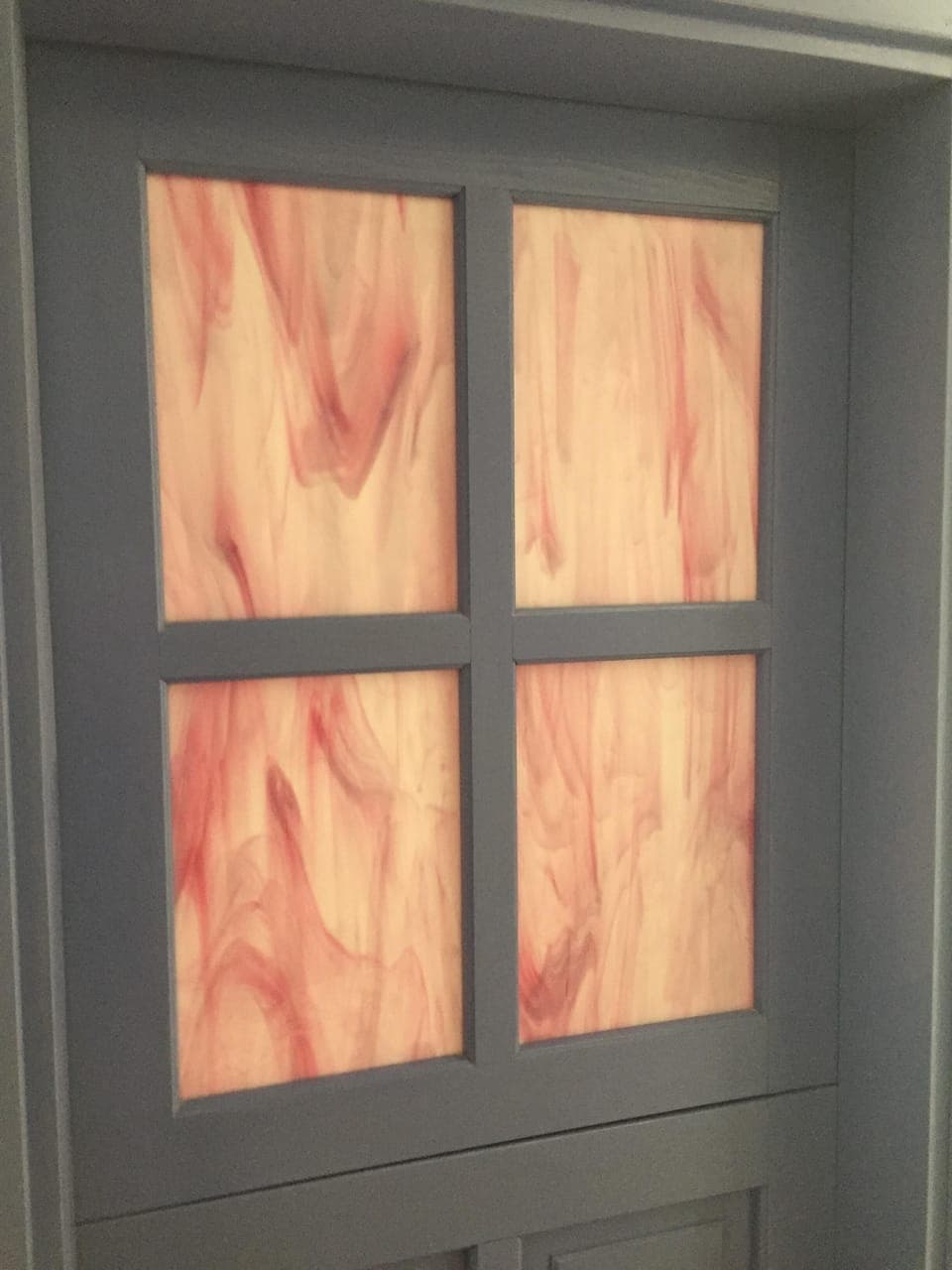 Hand-blown art glass in the door windows.