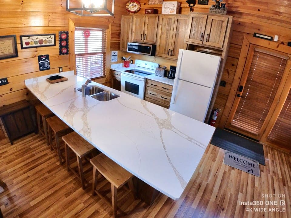Newly remodeled kitchen, extended countertop, microwave, cabinets.