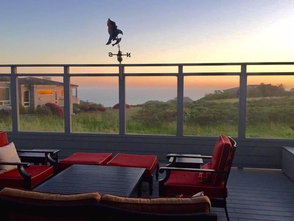 The deck is surrounded by glass walls to allow you to enjoy the view while blocking the wind.
