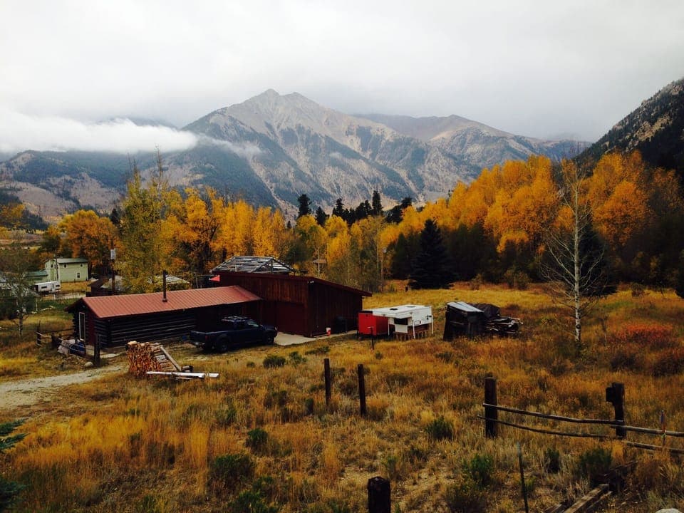 The cabin in the fall, looking down from the road above,