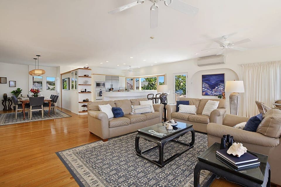 UPSTAIRS LIVING ROOM WITH KITCHEN IN THE BACKGROUND