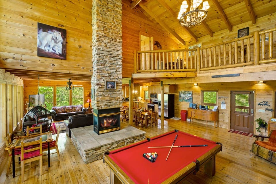 Spacious great room with dining for 12, domino table, pool table, and much more