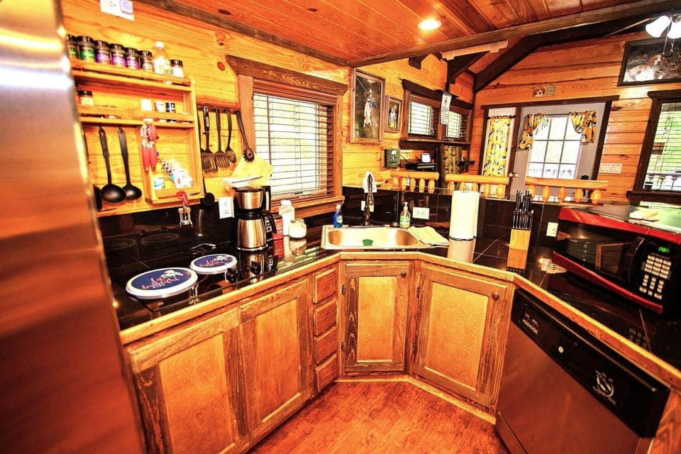 - Fully equipped rustic kitchen for easy cabin cooking   - Cabin essentials ready for forest getaway meals   - Warm wood design creating inviting culinary space