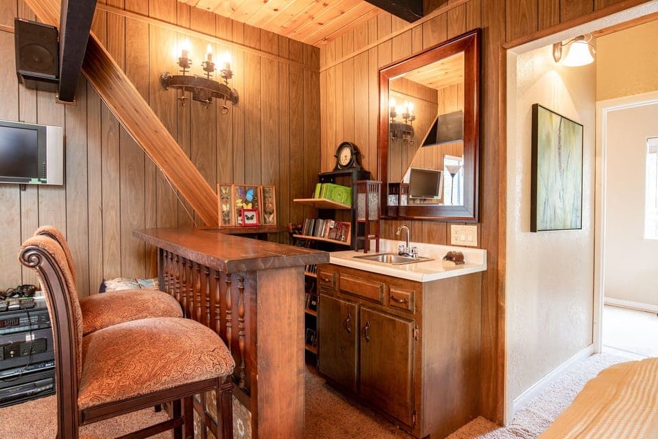 Peaceful cabin bedroom with plush bedding, and beautiful views—ideal for restful nights, cozy mornings, and a relaxing mountain escape.